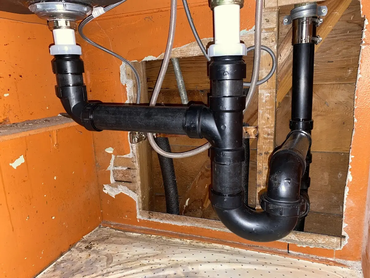 Professional Garbage Disposal Repair equipment and tools on the job in Carson